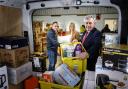 Gordon Brown (right), Pauline Buchan of The Cottage Family Centre and Simon McMahon (left) of Amazon’s UK Impact team at the warehouse.