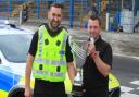 Police drivers Cammy Asmar and Stuart Hill proudly display their trophy.