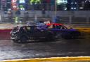 These two cars come to grief on the very wet track.