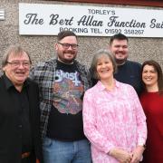 Bobby Dee with family of Bert Allan at the newly named function suite at Torleys.