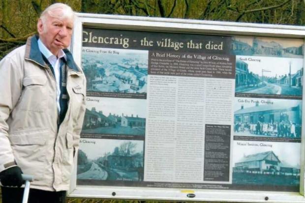 Willie Clarke with the message board in Glencraig.
