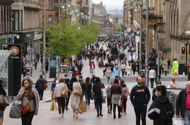 Central Fife Times: Shoppers on Buchanan Street, Glasgow today, Monday 26th April. Shops, cafes, pubs, hospitality venues, gyms and museums opened today due to the easing of lockdown restrictions.  Photograph by Colin Mearns26 April 2021