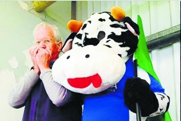 Ron Ferguson with his mouth organ and the Cowdenbeath FC mascot, Bluebell the coo.