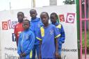 Kids in Mombasa wearing Crossgates Primrose football kits.