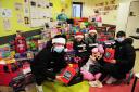 Joe Cardle gives gifts to the children's unit at the Victoria Hospital in Kirkcaldy, with his wife Lucy and children Josie-Anne (8) and Lyla-Jo (5). Photo: David Wardle