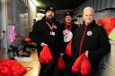 Gary Stevenson, Scott McLaughlin and Keith Stevenson with some of the bags for donation. Photo: David Wardle.