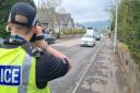 Police officers were outside local schools to advise motorists on their speeds