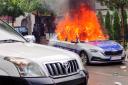 A Kosovar police car burns in Zvecan (AP)