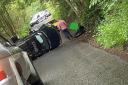 Police have closed Hill Road in Ballingry after a car crashed and flipped on its side.