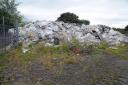 Work is continuing to find a solution to clear the tonnes of waste at Lathalmond.