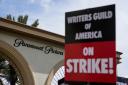 Members of the The Writers Guild of America picket outside Paramount Pictures (Ashley Landis/AP)