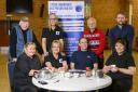 Tartan Talkers founder Jackie Walls (seated far right) with Go Fibre's Cameron Scott and volunteers Sharon Fors, Phyllis Taylor, Julia Watson, Ally Greenshields, Sandy Donaghy and John Love.