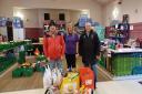 Bowhill Rovers secretary Brian Penman and committee member Gordon Hindley hand over the donations to  Margaret King from the Bowhill Centre.