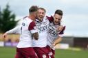 Lewis Moore (centre) has agreed a new Kelty Hearts contract.