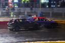 These two cars come to grief on the very wet track.
