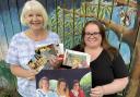Liz Rae (left) and Vicky Kinloch, directors of My Cowdenbeath, holding some of the gala archive pictures from years gone by. Photo: Stuart Duffy.