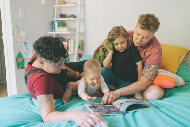Central Fife Times: A family reading a book together. Credit: Canva
