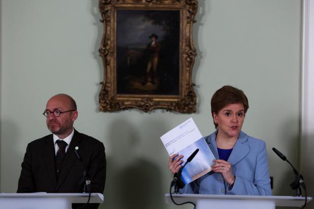 Central Fife Times: Scottish Government Minister and Scottish Green Party Co-Leader Patrick Harvie (left) and First Minister Nicola Sturgeon speaking at a press conference in Bute House in Edinburgh. Credit: PA
