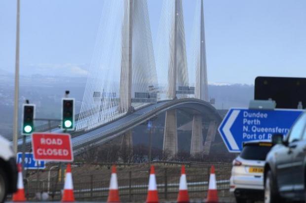The Queensferry Crossing when it closed in December 2020, due to ice forming on the towers and cables and falling onto the carriageway below. Work is continuing on 'several fronts' to tackle the problem.