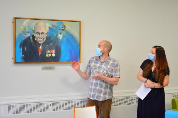 Artist Jon Brown gifted a painting of Captain Tom Moore for the hub.