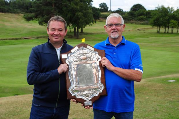 Barry Martin and Brian Robinson with the returned trophy. Photo: David Wardle.