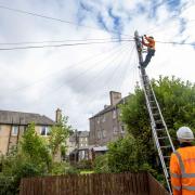 penreach say they are putting up telegraph poles in Kelty as part of their plans to build a new ultrafast broadband network in the village.