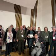 Benarty Heritage Preservation Group members at the Scottish Parliament with Annabelle Ewing MSP, holding her copy of the 2024 calendar.