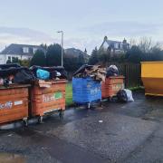 Overflowing recycling bins at Foulford Place, alongside the new glass recycling skip.