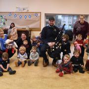 The group celebrated with lunch and a visit from a local piper, Kieran Roberts.