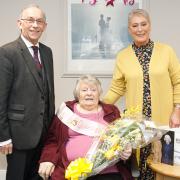 Margaret Wallace is presented with flowers on behalf of Fife Council by Councillor Rosemary Liewald, while the Fife Lieutenacy was represented by Depute Lieutenant Col Jim Kinloch.