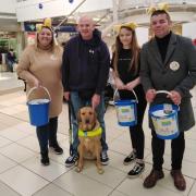 Karen and her family fundraising for Guide Dogs UK.