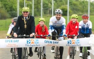 Provost Jim Leishman and Mark Beaumont open Fife Cycle Park in 2018 alongside local children and racing cyclist Eileen Roe.