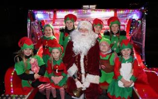 Santa Benarty and his crew of elves will lead the Christmas Parade on Friday.